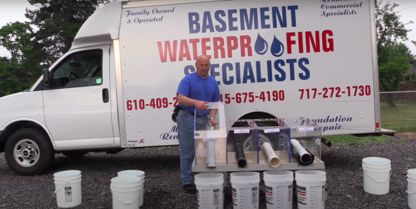 Our crew setting up an interior drainage system for a basement waterproofing job in Freehold NJ