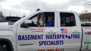 Our crew, plus their 4-leg supervisor, getting ready to waterproof a basement in Toms River NJ