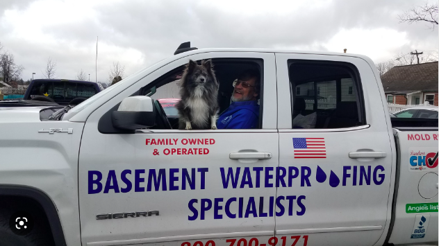 Our crew, plus their 4-leg supervisor, getting ready to waterproof a basement in Toms River NJ