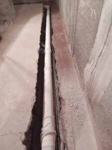 Drain pipe as part of a residential basement waterproofing in Snyder County PA.