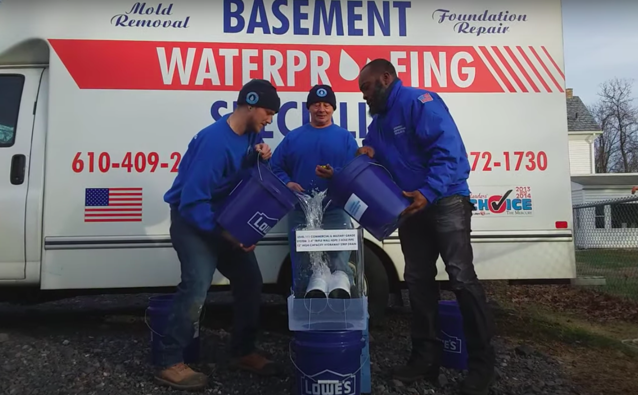 Our crew testing the drains that we use on basement waterproofing jobs like on this house in Glassboro NJ.