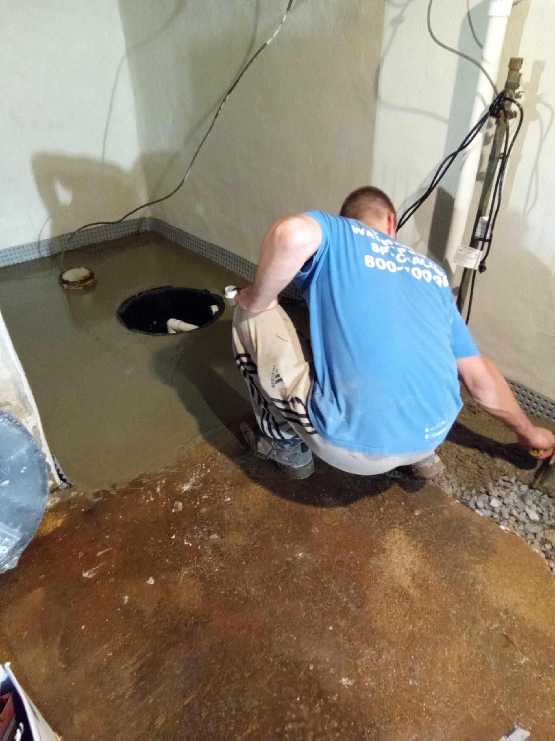 Finishing the sump pump on this basement waterproofing system in Kingston PA.