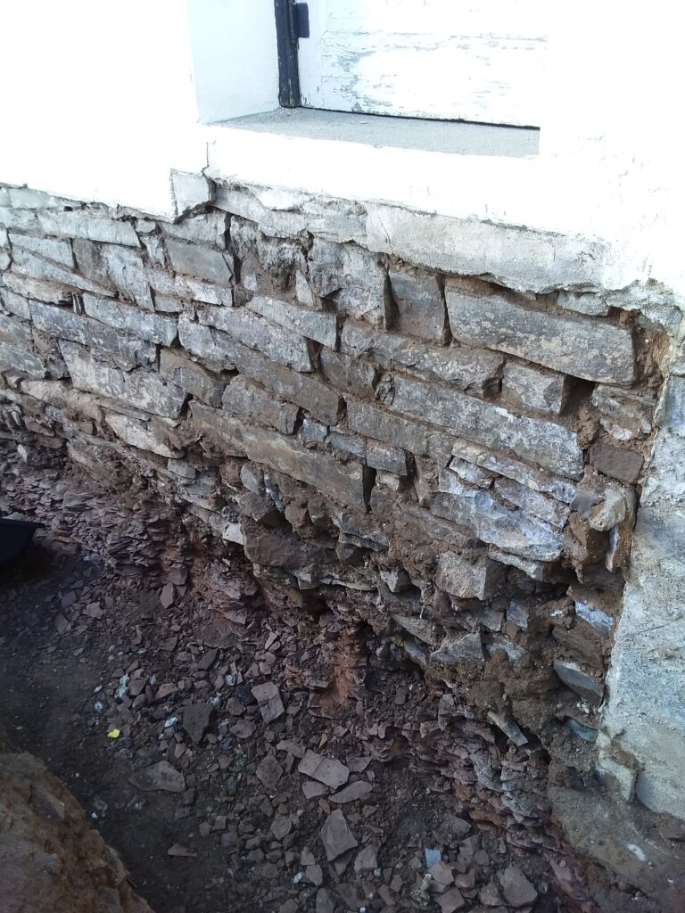 Exterior of a basement waterproofing in Long Branch NJ. Fixing the external problem.