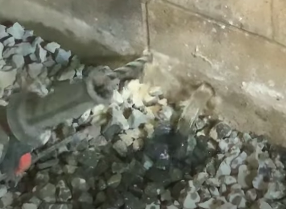 Waterproofing Basement by drilling 'weep holes' to let the water out in Middletown Township NJ.