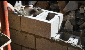 Rebuilding a foundation wall as part of a basement waterproofing job in Ocean County NJ