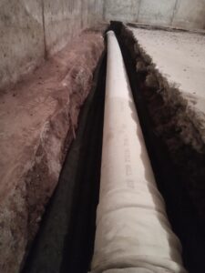 Drain pipe installed in this basement waterproofing system in Pike County PA.