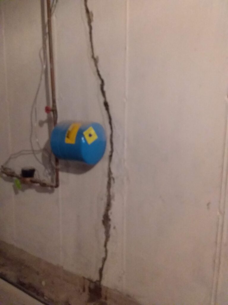 Walk crack repair during a basement waterproofing in Wilkes-Barre PA