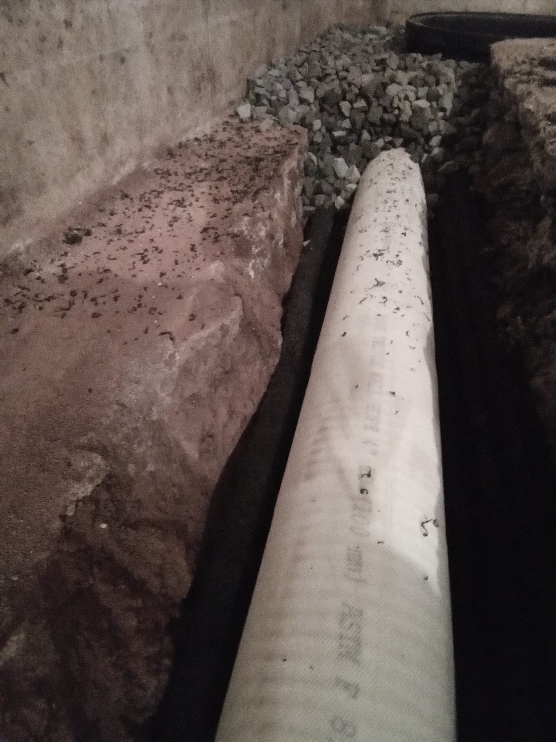 Large drain pipe as part of this basement waterproofing system in Adams County PA.